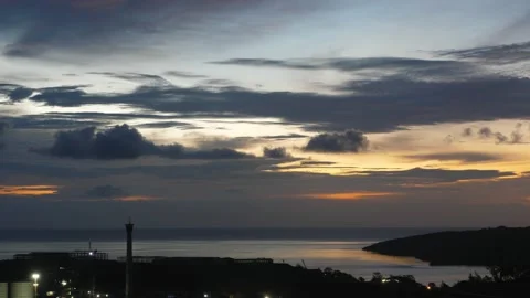 After sunset in the evening, the colorful clouds on the sea covered the sky 動画素材 142248440