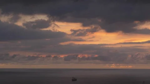 After sunset in the evening, the colorful clouds on the sea covered the sky 動画素材 142248530