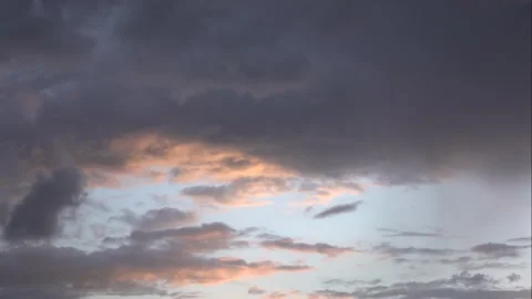 The afterglow of the Setting Sun under Clouds during Summer Evening Sky Stock Footage 331984828