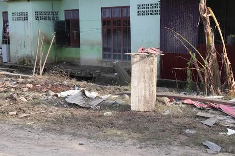 Aftermath of a Devastating Flood with Debris and Damaged House Stock Photos