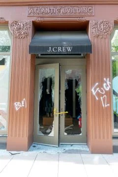 Aftermath of a Looted J. Crew storefront in Downtown Washington DC Stock Photos