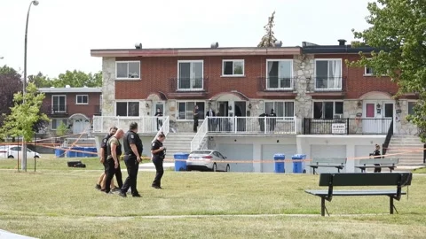 The aftermath of a shooting in Longueuil, Canada. A group of police Stock Footage 162299074