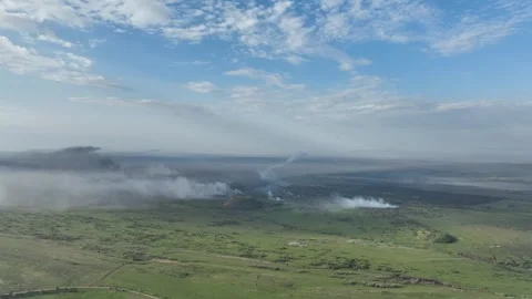 Aftermath of War: Smoke Rises from Torched Landscapes in Donbas, Ukraine Stockbeeldmateriaal 312118180