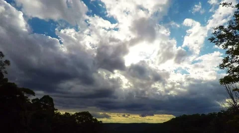 Afternoon Clouds Moving Over the Valley with Sunlight Breaking Through Stock Footage 66457105