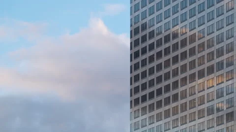 Afternoon clouds reflected in office windows 4K Stock Footage 61139377