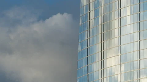 Afternoon clouds reflected in skyscraper windows HD Stock Footage 61140053