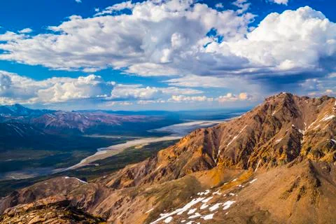 Afternoon Storm Clouds Develop Over The Mountain Ridges Of The Alaska Range And Stock Photos