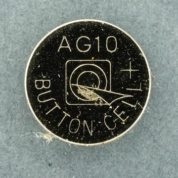 AG10 button cell battery providing small power Stock Photos