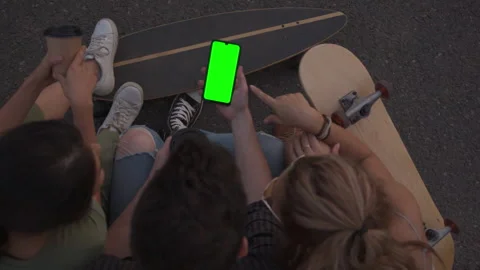 Again together. Green screen. Multiracial Friends sit together after a long Vidéo 154177396