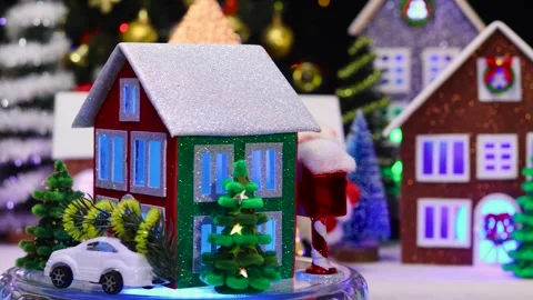 Against the backdrop of a large Christmas town, a three-colored house Stock-Footage 293427859