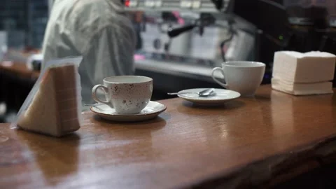 Against the background of the bar table, the barista prepares coffee. Video stock 165001699