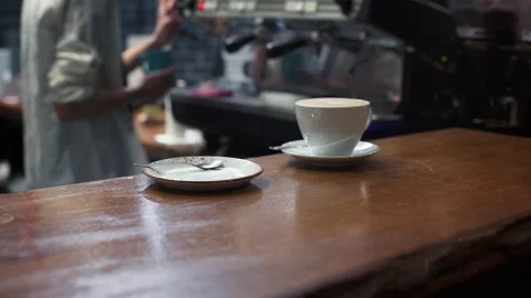 Against the background of the bar table, the barista prepares coffee. Video stock 165001921