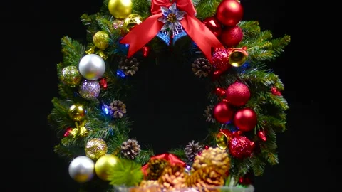 Against the background of a Christmas wreath a vase with cones Stock Footage 166340468