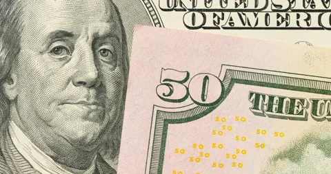 Against the background of a hundred-dollar banknote, banknotes of all Stock Footage 128477699