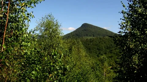 Against the background of the mountain trees covered in forest Stock Footage 69055732