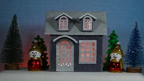 Against a background with multi -colored backlighting one gray house Stock Footage 312325795