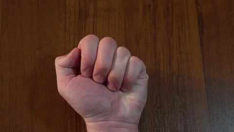 Against the background of the table. Open your palm and inside the green pill Stock Footage 130199073