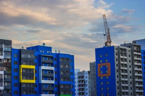 Against the background of a tower crane Stock Photos