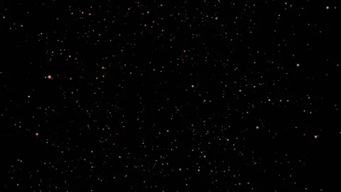 Against a black background, the continuous movement of golden twinkling lights Stock Footage 153767772
