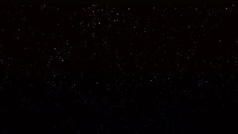 Against a dark background, blue and purple particles fly chaotically. Animated Stock Footage 232947977