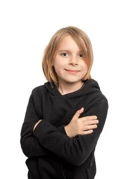 Against a pristine white setting, a ten-year-old boy with flowing long hair.. Stock Photos