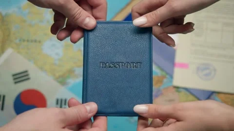 Against world map migration service worker issues South Korean passport to Stock Footage 331262684