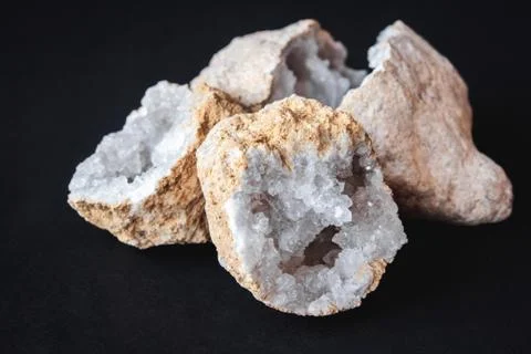 Agate. A cross section of agate stone with geode on a black background. Origi Stock Photos