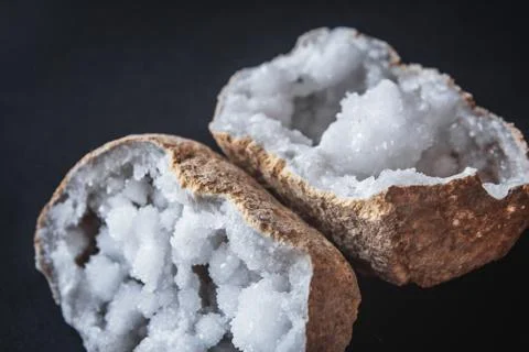 Agate. A cross section of agate stone with geode on a black background. Origi Stock Photos