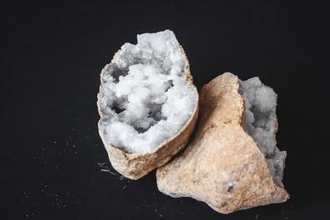 Agate. A cross section of agate stone with geode on a black background. Origi Stock Photos