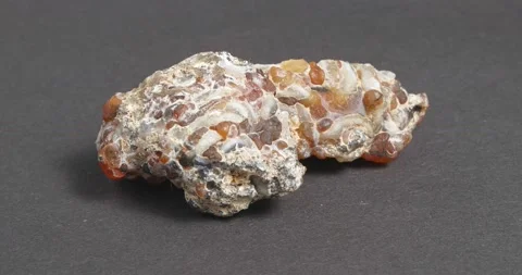 Agate geode on a dark background. Outer shell. Видео 164284791