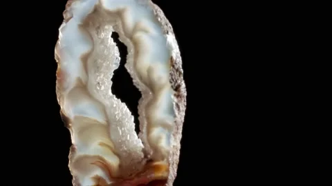 Agate with quartz. Agate rotates around its axis on a black background. Stock Footage 133400919