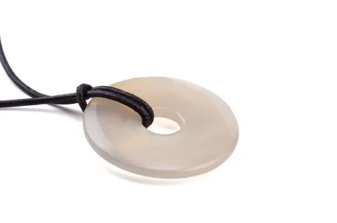 Agate stone donut on leather string Stock-Fotos