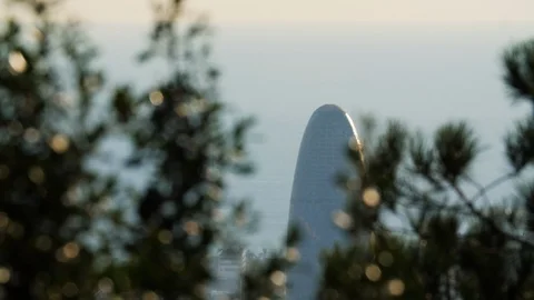 Agbar Tower close up. Pan focus to Trees. Barcelona, Spain Stock Footage 106435833