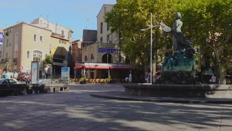 Agde Centre with old Buildings and a sculpture in the fountain, street view Stock Footage 144247722