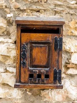 Age mailbox on a house wall Stock Photos