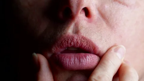 Age-related skin changes the texture of the lips and wrinkles around   Stock Footage 301313757
