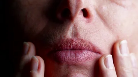 Age-related skin changes the texture of the lips and wrinkles around the mouth  Stock Footage 302172730