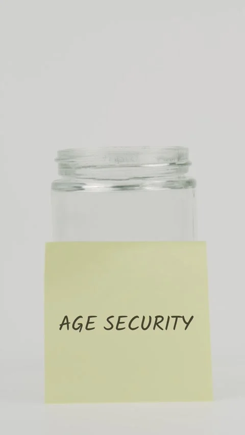 Age security text or word on yellow sticky note attached to glass jar Stock Footage 311676520