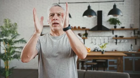 Aged athletic male is setting timer on smartwatch gadget and holding breath Stock Footage 146711235