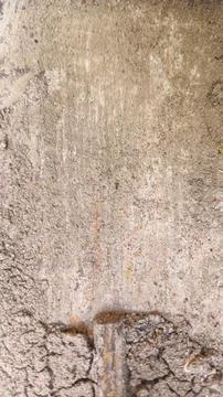 Aged beige wall surface with visible dirt smudges, peeling marks, and faded.. Stock Photos