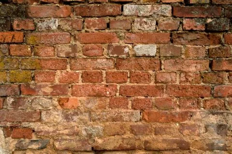 Aged brick wall Stock Photos