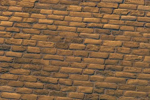 Aged Brick Wall in Rustic Stone with Weathered Mortar Stock Photos