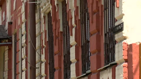 Aged building facade with broken windows in old historical town, loneliness Stock Footage 90709047