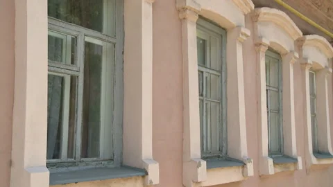 Aged building facade with windows in old historical town, loneliness Stock Footage 90700999