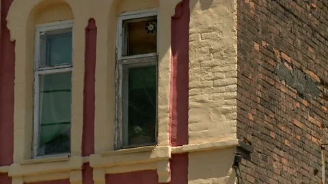 Aged building facade with windows in old historical town, loneliness Stock Footage 90702620
