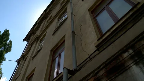 Aged building facade with windows in old historical town, loneliness Stock Footage 90708008