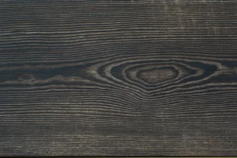 Aged, burned rustic braun dark pine wood texture. Boards with a knot. Grunge  Stock Photos