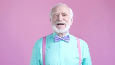 Aged cheerful man laugh at camera enjoy isolated pastel color background Stock Footage 190910026