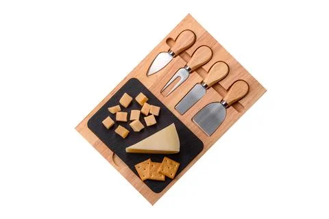 Aged cheese in a triangular block with jam, figs, and nuts. Aged cheese Stock Photos