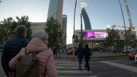 Aged copule walking towards City Life Milano, 4k Stock Footage 285018821